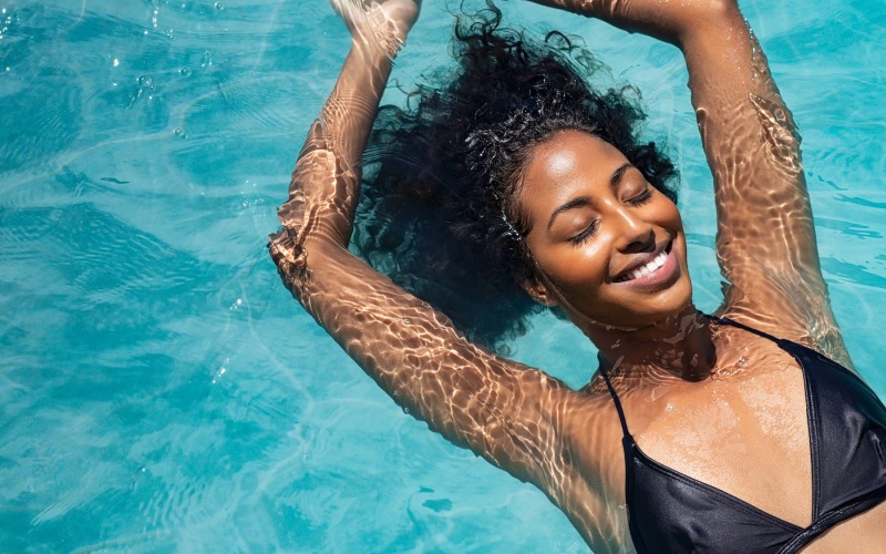 a woman swimming in a pool