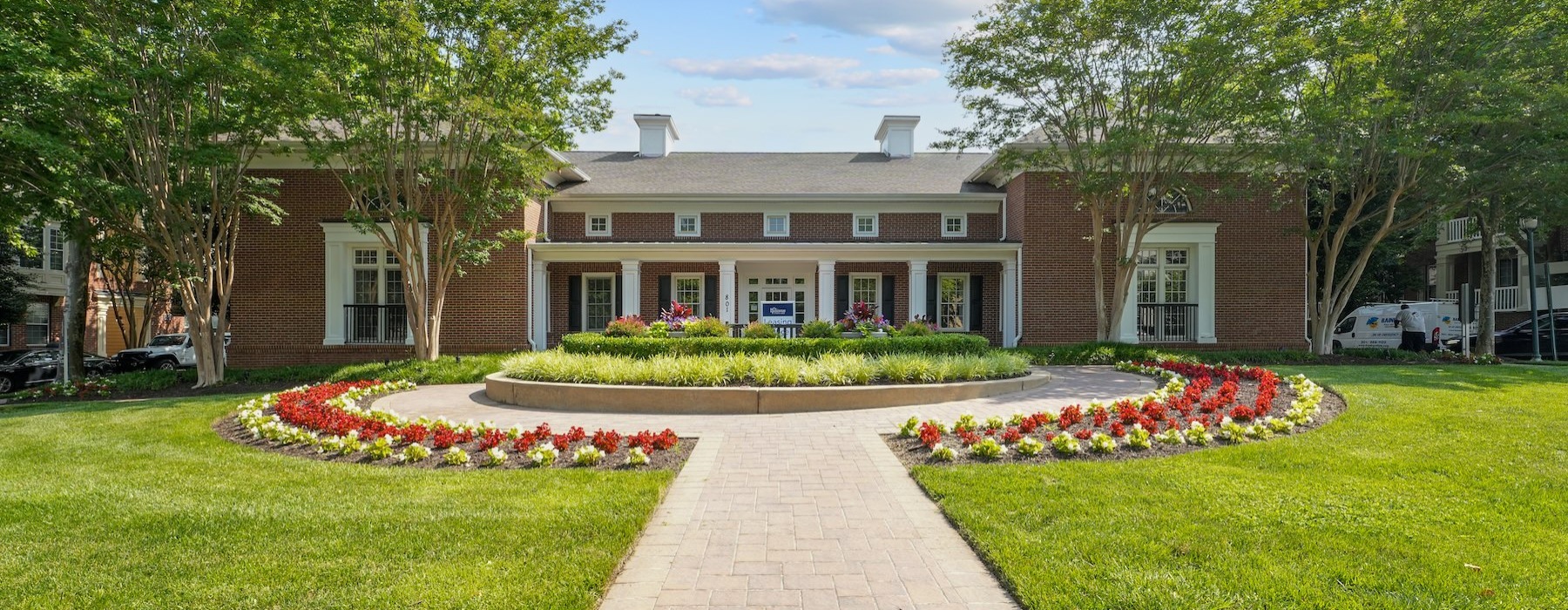a brick walkway leading to a building